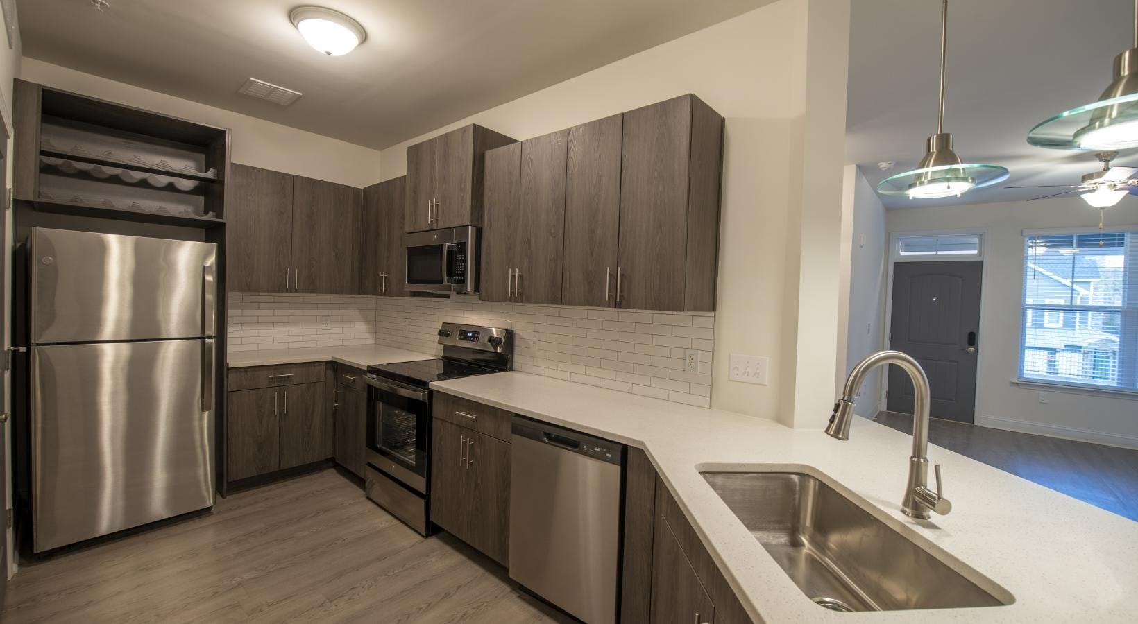 a kitchen with wooden cabinets