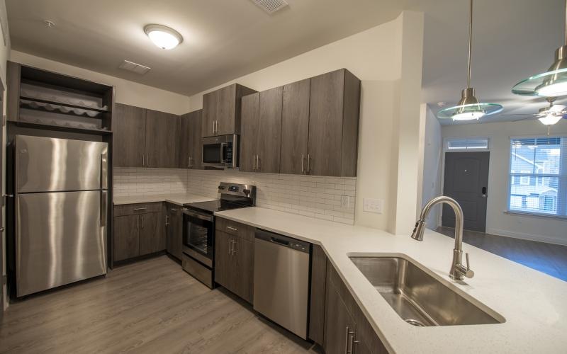a kitchen with wooden cabinets